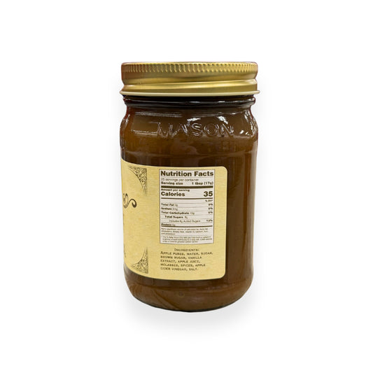 Buc-ee's Apple Butter 16.5 oz mason jar side view showing nutrition facts label with 25 servings per container, ingredients list including apple puree and traditional spices, and golden vintage-style labeling