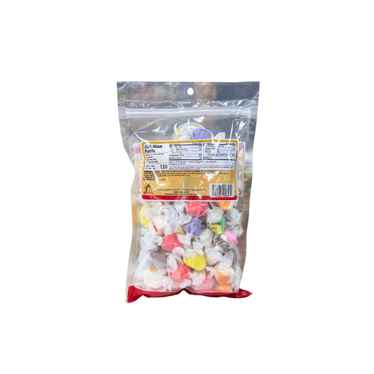 Buc-ee's assorted taffy bag back showing nutrition facts and pastel colored individually wrapped taffy pieces in pink, yellow, purple, white
