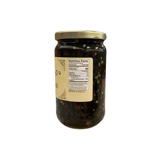 Buc-ee's Candied Jalapeños 20 oz glass jar side view showing nutrition facts label, dark candied jalapeño pieces with visible seeds and spices, and golden yellow vintage-style labeling
