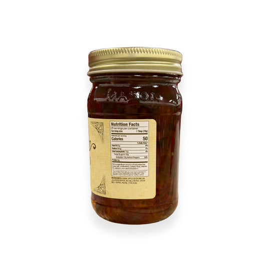 Buc-ee's Jalapeño Jelly 17.5 oz mason jar side view showing nutrition facts label with 25 servings per container, ingredients list including jalapeño peppers and bell peppers, and golden vintage-style labeling
