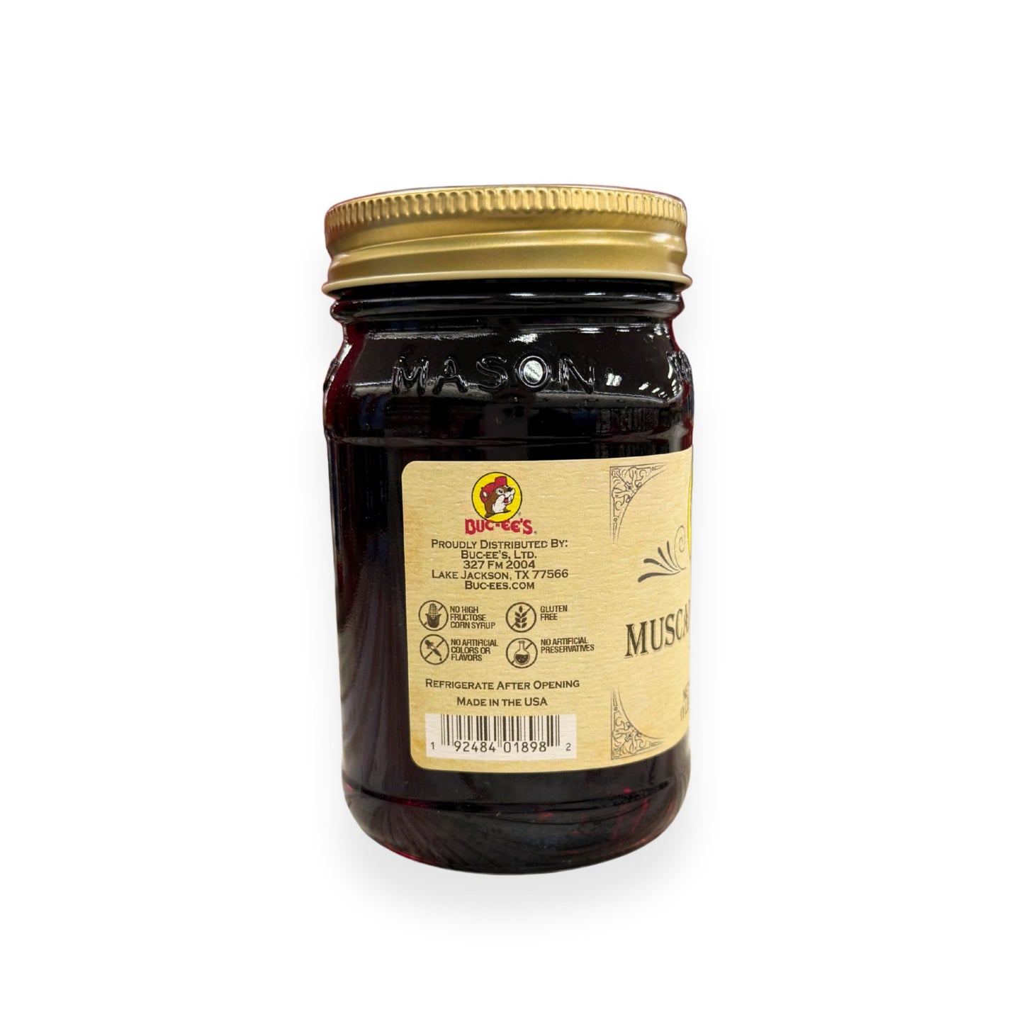 Buc-ee's Muscadine Grape Jelly 17.5 oz mason jar back view showing Buc-ee's distributor information, product certifications including gluten-free and no artificial preservatives, barcode, and classic mason jar styling
