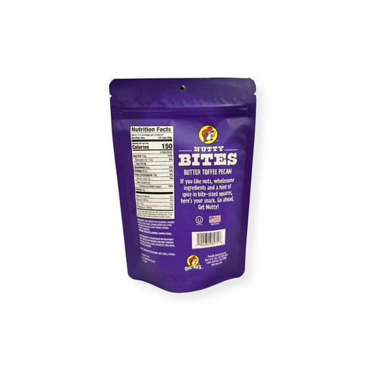 Buc-ee's Nutty Bites Butter Toffee Pecan 3.5 oz purple pouch back view showing detailed nutrition facts label with 150 calories per serving and wholesome ingredient information with "Get Nutty" messaging