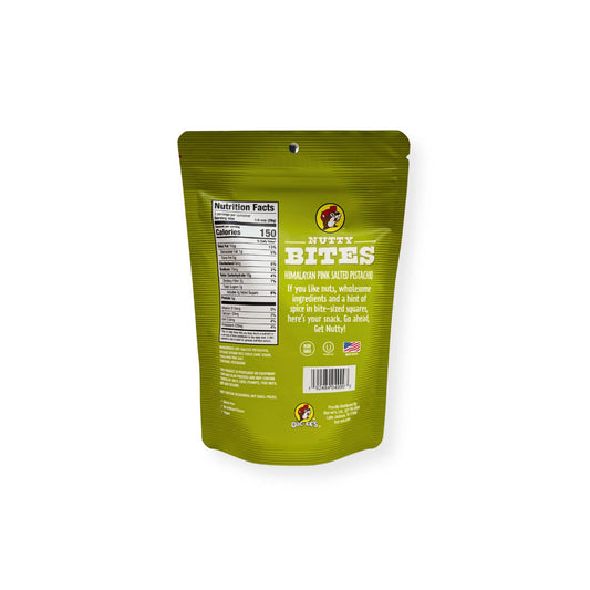 Buc-ee's Nutty Bites Himalayan Pink Salted Pistachio 3 oz green pouch back view showing detailed nutrition facts label with 150 calories per serving and wholesome ingredient information with "Get Nutty" messaging