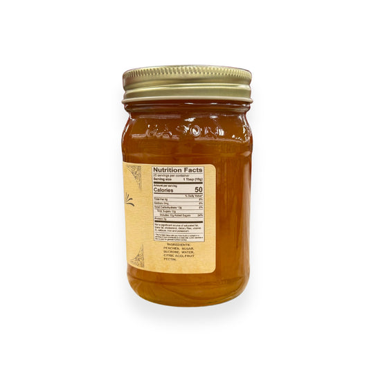 Buc-ee's Peach Preserves 17.5 oz mason jar side view showing nutrition facts label with 25 servings per container, ingredients list including peaches and fruit pectin, and golden vintage-style labeling