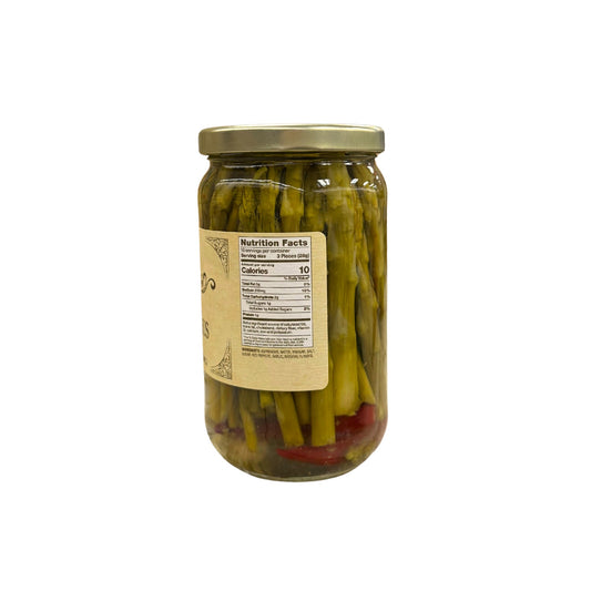 Buc-ee's Pickled Asparagus 16 fl oz glass jar side view showing nutrition facts label, crisp green asparagus spears in clear brine with red pepper pieces, and golden yellow vintage-style labeling