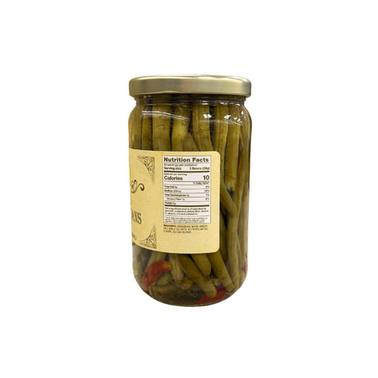 Buc-ee's Pickled Green Beans 16 fl oz glass jar side view showing nutrition facts label, crisp green bean pods with red pepper pieces in clear brine, and golden yellow vintage-style labeling