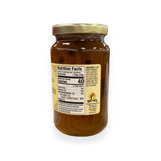 Buc-ee's Pineapple Jalapeño Jelly 17 oz mason jar side view showing nutrition facts label with 25 servings per container, ingredients list including pineapple juice and jalapeños, and golden vintage-style labeling