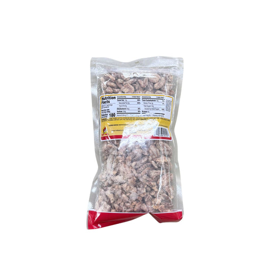 Buc-ee's Praline Pecans 12 oz clear plastic bag back view showing detailed nutrition facts label with 180 calories per serving and ingredient information