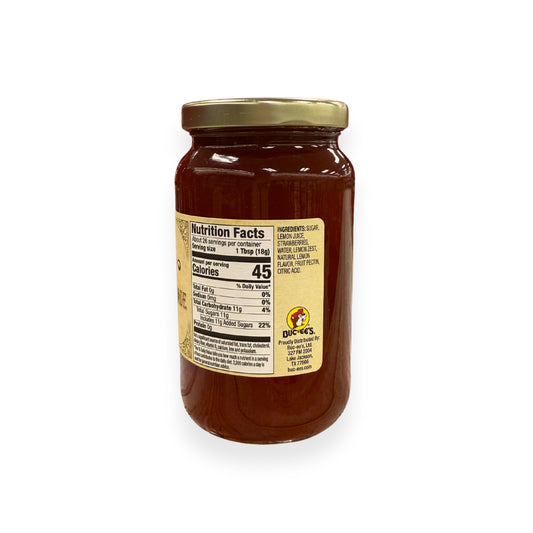 Buc-ee's Strawberry Lemonade Jam 17 oz mason jar side view showing nutrition facts label with 26 servings per container, ingredients list including strawberries and lemon juice, and golden vintage-style labeling