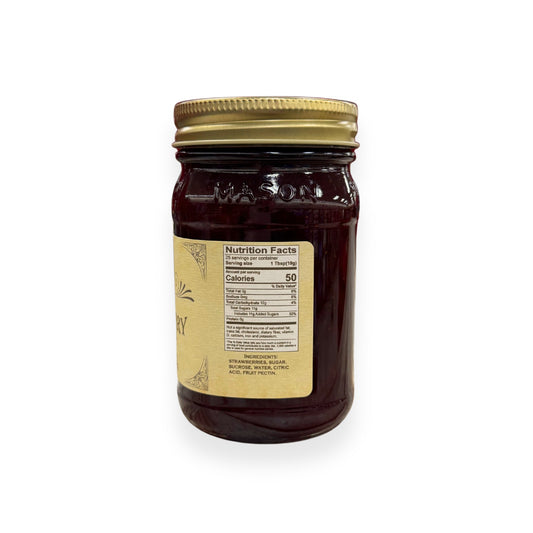 Buc-ee's Strawberry Preserves 17.5 oz mason jar side view showing nutrition facts label with 25 servings per container, ingredients list including strawberries and fruit pectin, and golden vintage-style labeling