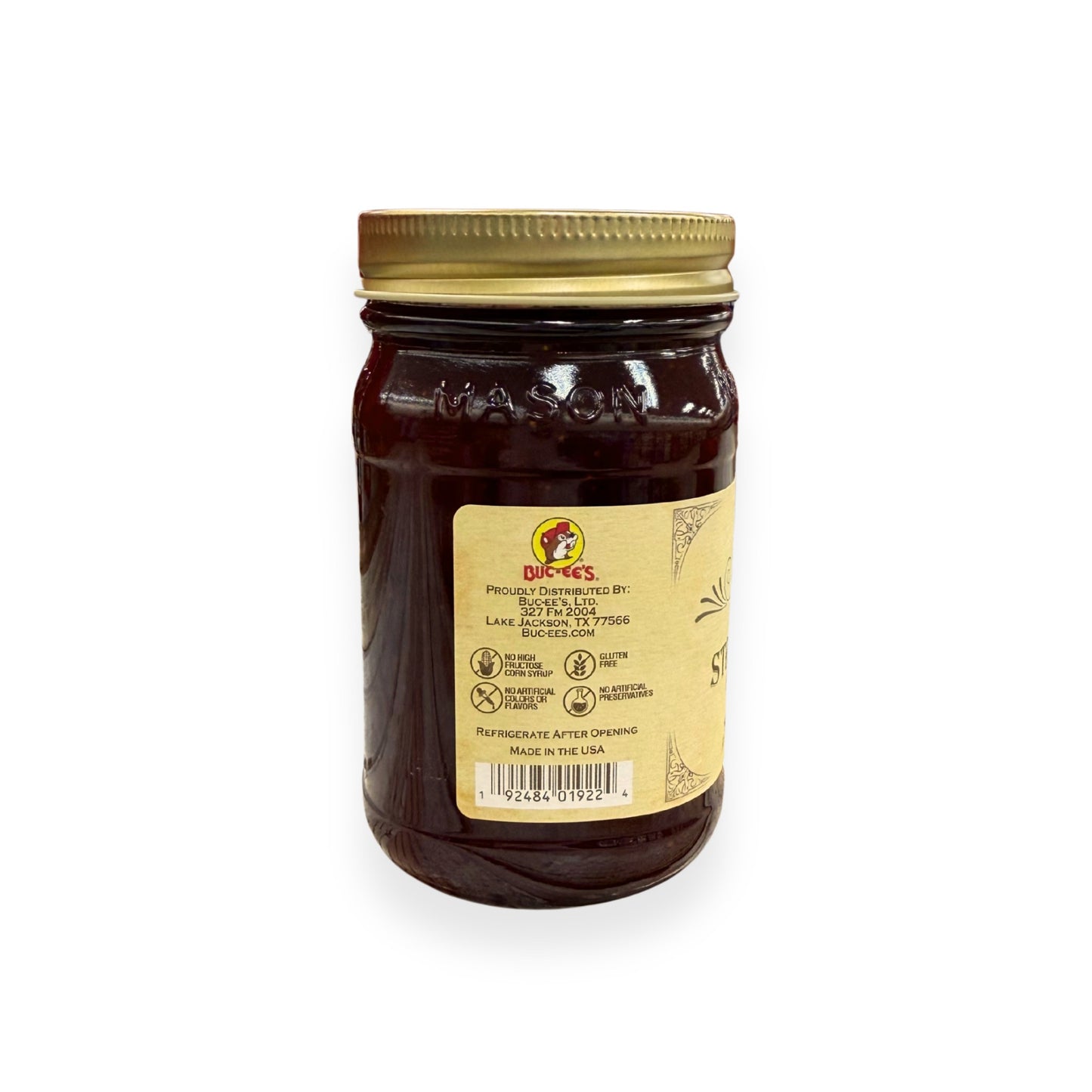 Buc-ee's Strawberry Preserves 17.5 oz mason jar back view showing Buc-ee's distributor information from Lake Jackson TX, gluten-free certification, no artificial preservatives badges, barcode, and storage instructions