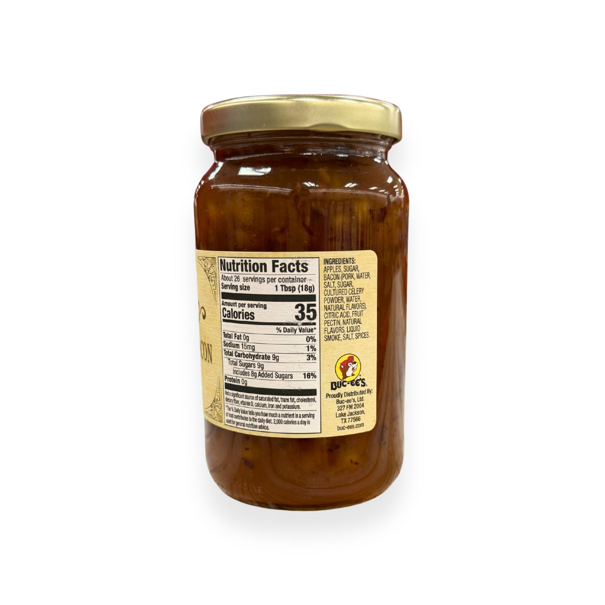 Buc-ee's Apple Maple Bacon Jam 17 oz mason jar side view showing nutrition facts label with 26 servings per container, detailed ingredients list including apples, bacon, and natural maple flavors, and golden vintage-style labeling