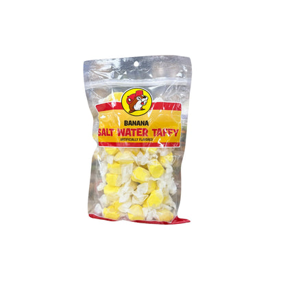 Buc-ee's banana salt water taffy bag showing bright yellow individually wrapped candy pieces with Bucky logo on yellow and red label