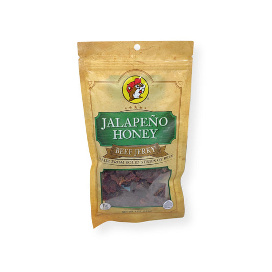 Buc-ee's Jalapeño Honey Beef Jerky 4oz bag front view showing gold and green packaging with Buc-ee's beaver logo and premium beef jerky strips visible