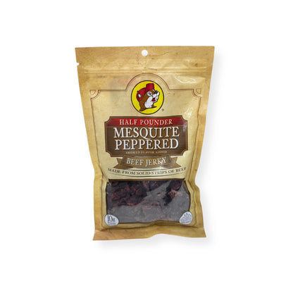 Buc-ee's Mesquite Peppered Beef Jerky 8oz package front featuring iconic red beaver mascot logo, clear window showing dark smoky jerky strips, and golden yellow resealable packaging