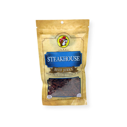 Buc-ee's Steakhouse Beef Jerky 4oz bag front view showing gold and blue packaging with Buc-ee's beaver logo and classic seasoned beef jerky strips visible