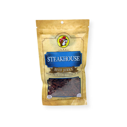 Buc-ee's Steakhouse Beef Jerky 4oz bag front view showing gold and blue packaging with Buc-ee's beaver logo and classic seasoned beef jerky strips visible