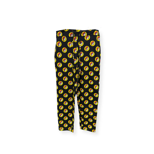 Black Buc-ee's pajama pants with all-over repeating yellow circle logo pattern, elastic waistband, unisex loungewear design