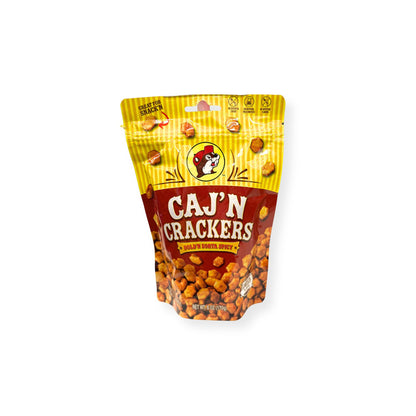 Buc-ee's Caj'N Crackers 6 oz bright yellow and red pouch front view featuring iconic red beaver mascot logo, "CAJ'N CRACKERS" text with "BOLD'N SORTA SPICY" banner, and visible Cajun-seasoned crackers