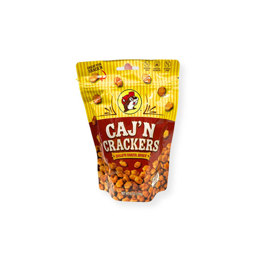 Buc-ee's Caj'N Crackers 6 oz bright yellow and red pouch front view featuring iconic red beaver mascot logo, "CAJ'N CRACKERS" text with "BOLD'N SORTA SPICY" banner, and visible Cajun-seasoned crackers