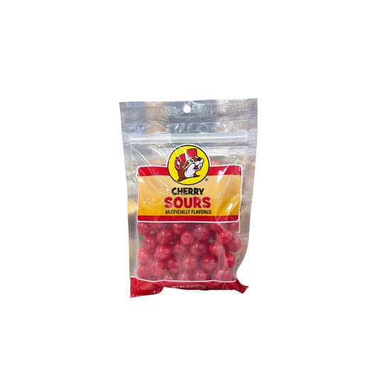 Buc-ee's cherry sours candy bag showing bright red round cherry-flavored candy balls with Bucky logo on yellow and red label