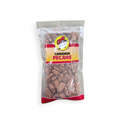 Buc-ee's Cinnamon Pecans 12 oz clear plastic bag front view featuring iconic red beaver mascot logo, "CINNAMON PECANS" text, and visible cinnamon-coated pecans through clear packaging
