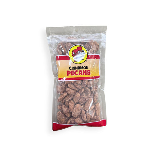 Buc-ee's Cinnamon Pecans 12 oz clear plastic bag front view featuring iconic red beaver mascot logo, "CINNAMON PECANS" text, and visible cinnamon-coated pecans through clear packaging
