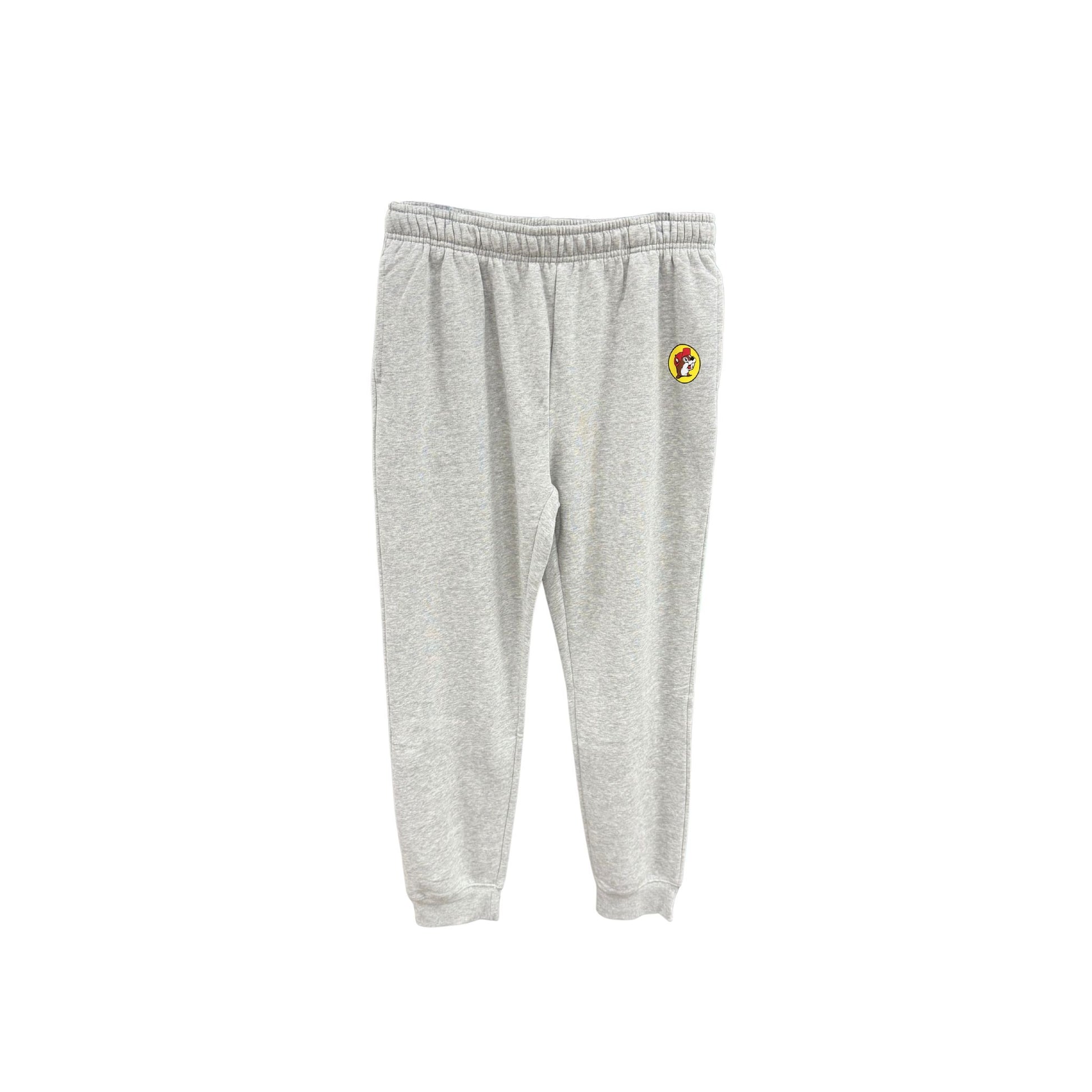 Gray heather Buc-ee's jogger sweatpants with subtle yellow circle logo patch on hip, elastic waistband with drawstring, and elastic ankle cuffs