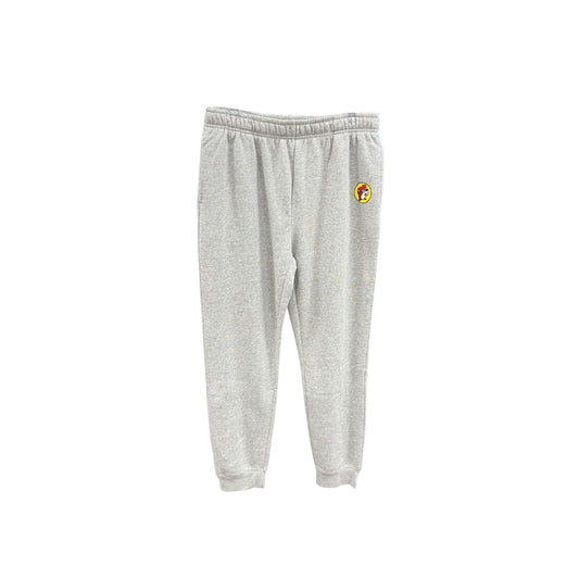 Gray heather Buc-ee's jogger sweatpants with subtle yellow circle logo patch on hip, elastic waistband with drawstring, and elastic ankle cuffs