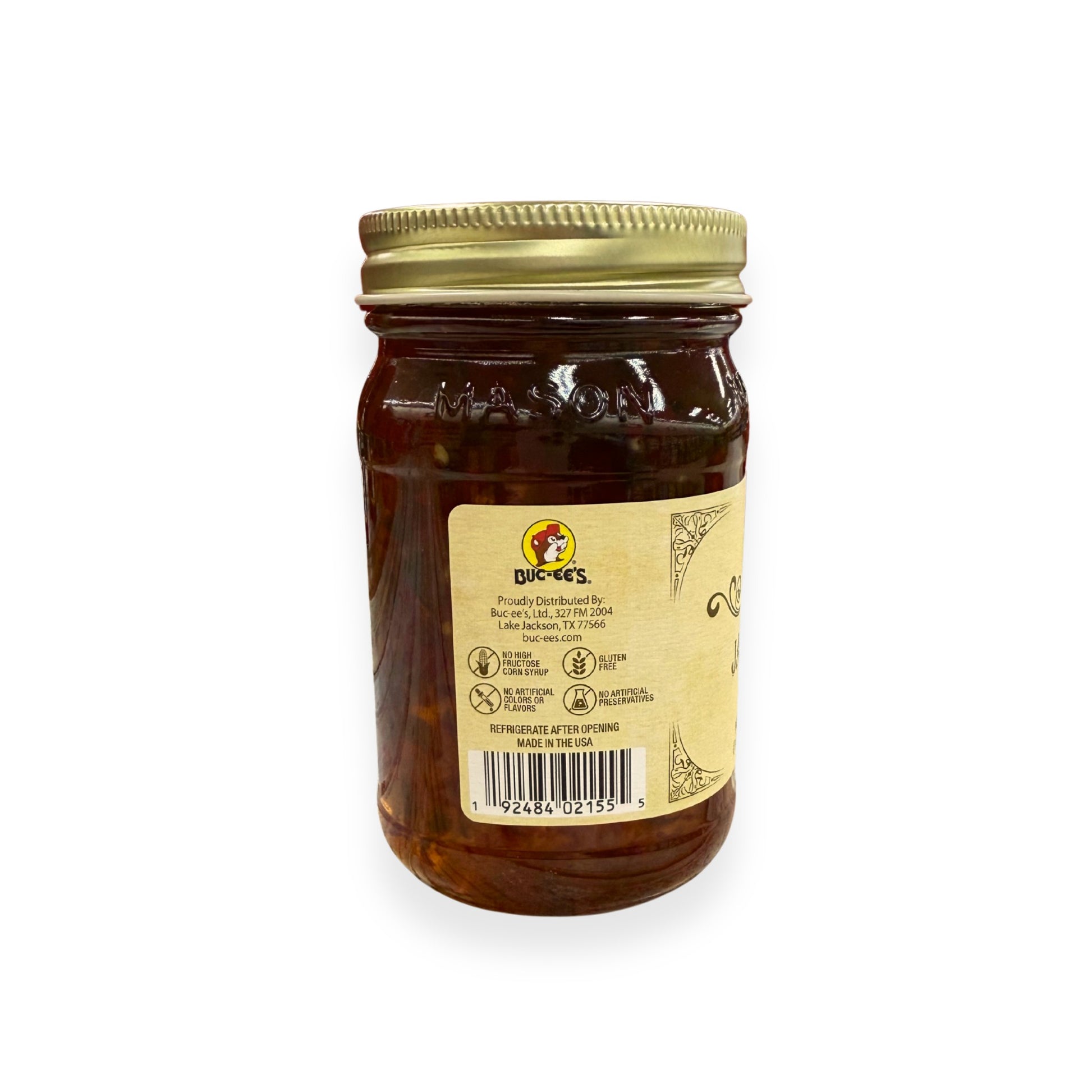 Buc-ee's Jalapeño Jelly 17.5 oz mason jar back view showing Buc-ee's distributor information from Lake Jackson TX, gluten-free certification, no artificial preservatives badges, barcode, and storage instructions