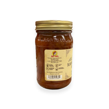Buc-ee's Mango Pineapple Habanero Salsa 14 oz mason jar back view showing Buc-ee's distributor information from Lake Jackson TX, gluten-free certification, no artificial preservatives badges, barcode, and storage instructions