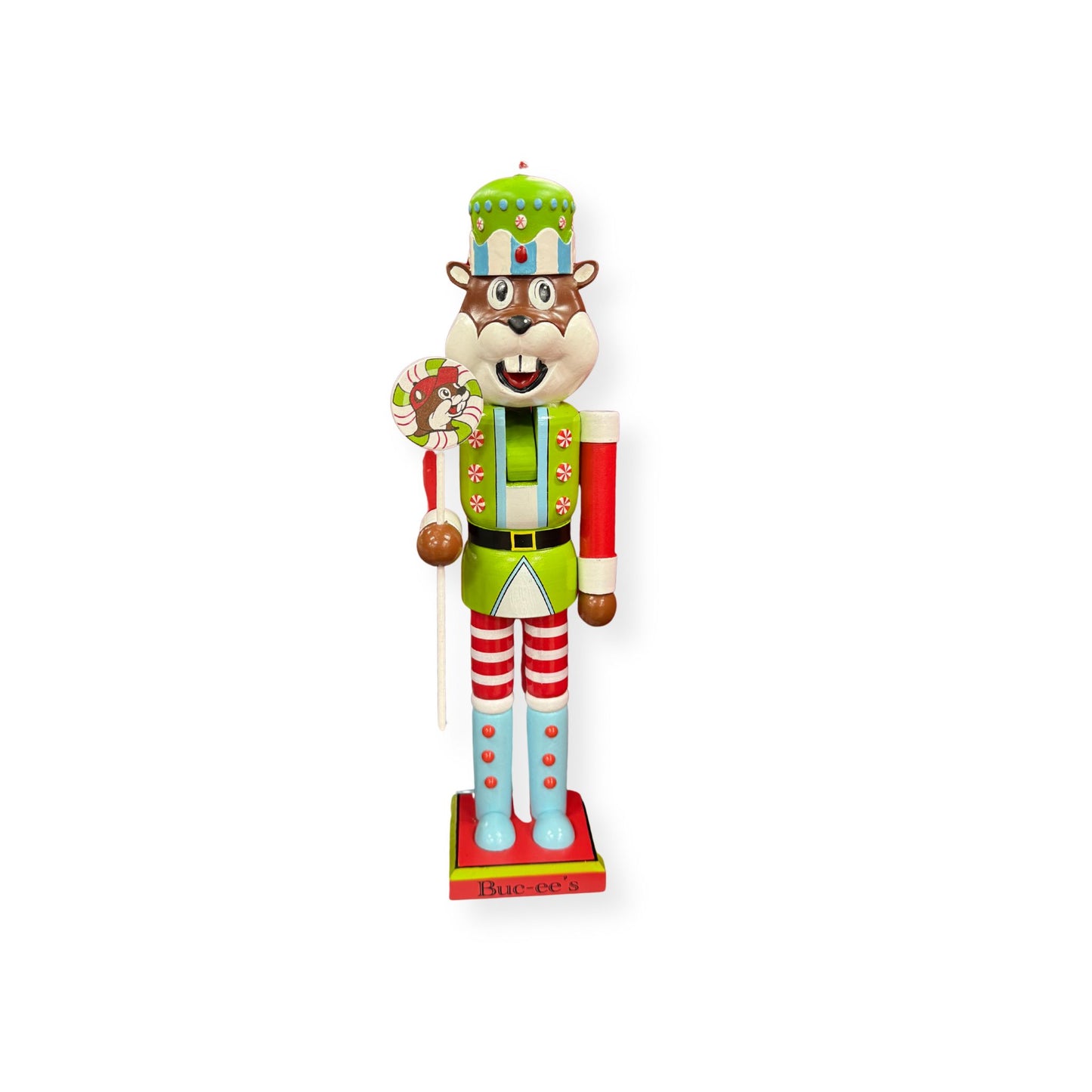 Front view of Buc-ee's 2025 nutcracker beaver showing decorative hat with candy embellishments, candy cane accessory, and lime green uniform with festive decorations