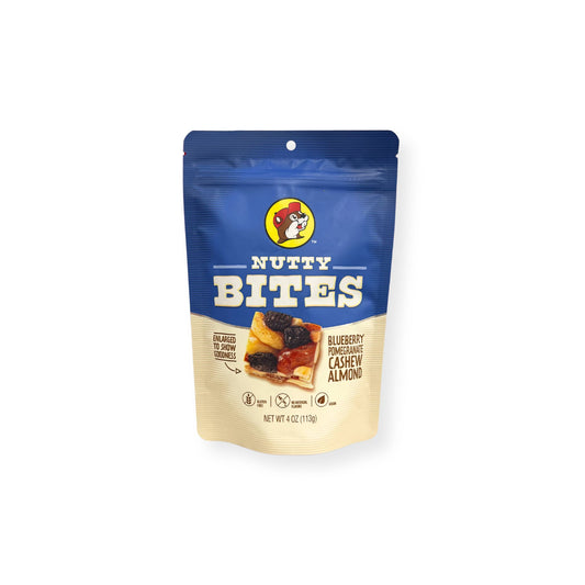 Buc-ee's Nutty Bites 4 oz blue and cream pouch front view featuring iconic red beaver mascot logo, "NUTTY BITES" text, "BLUEBERRY POMEGRANATE CASHEW ALMOND" description, and enlarged product image showing goodness