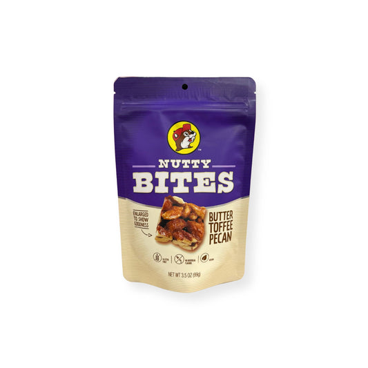 Buc-ee's Nutty Bites Butter Toffee Pecan 3.5 oz purple and cream pouch front view featuring iconic red beaver mascot logo, "NUTTY BITES" text, "BUTTER TOFFEE PECAN" description, and enlarged product image showing goodness