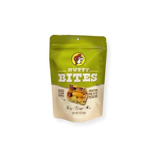 Buc-ee's Nutty Bites Himalayan Pink Salted Pistachio 3 oz green and cream pouch front view featuring iconic red beaver mascot logo, "NUTTY BITES" text, "HIMALAYAN PINK SALTED PISTACHIO" description, and enlarged product image showing goodness