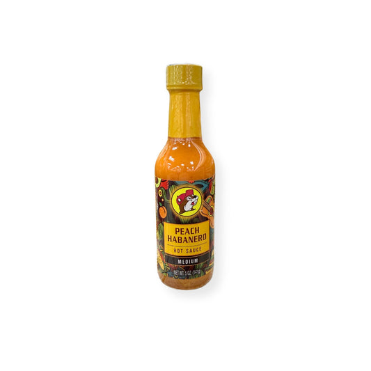 Buc-ee's Peach Habanero Hot Sauce 5 oz bottle front view featuring yellow bottle cap with beaver mascot logo, "PEACH HABANERO HOT SAUCE" text, "MEDIUM" heat designation, and colorful tropical-themed label with fruit graphics