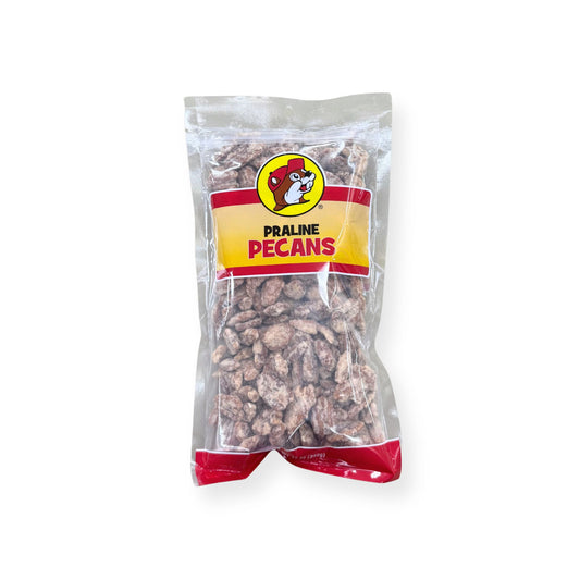 Buc-ee's Praline Pecans 12 oz clear plastic bag front view featuring iconic red beaver mascot logo, "PRALINE PECANS" text, and visible praline-coated pecans through clear packaging