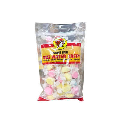 Buc-ee's state fair salt water taffy bag showing assorted pastel colored individually wrapped candy pieces with Bucky logo on yellow and red label
