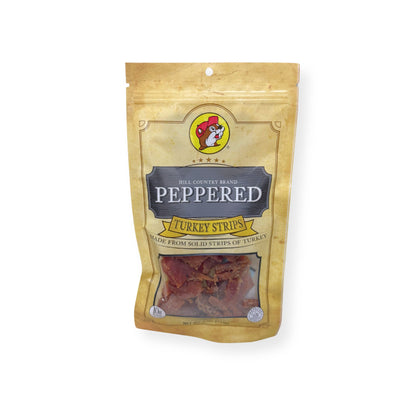 Buc-ee's Hill Country Brand Peppered Turkey Strips 4oz package front featuring iconic red beaver mascot logo, clear window showing light-colored turkey strips, and golden yellow resealable packaging with Hill Country Brand label