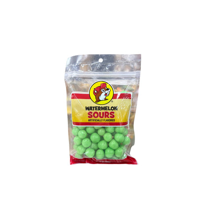 Buc-ee's watermelon sours candy 12oz resealable bag with bright green candy balls visible, Bucky logo on yellow and red label