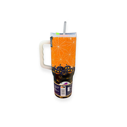 Yukon Outfitters 40oz Halloween 2025 tumbler with orange spider web design, jack-o'-lantern pattern, and glow-in-the-dark tag